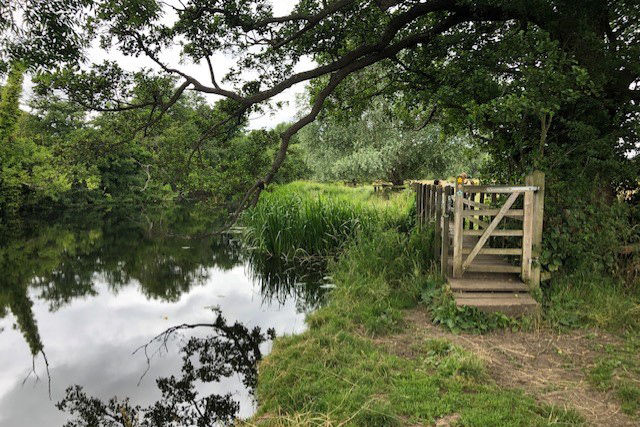 Image: A gate and footbridge next to the River Stour, photo by Johanna Ward