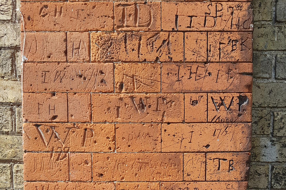 Graffiti on the wall of Sherman's Hall in Dedham'