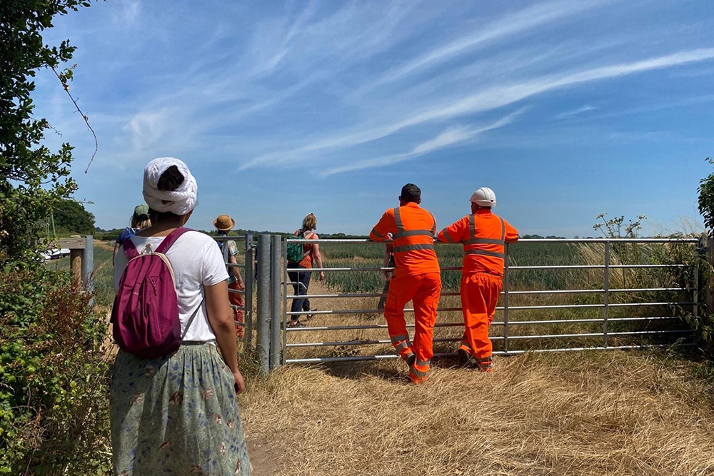 As we turn around a bend, we are presented with two construction workers, who look onto Constable Country, augmented through their dazzling protective gear, picture by Caroline Bassett.